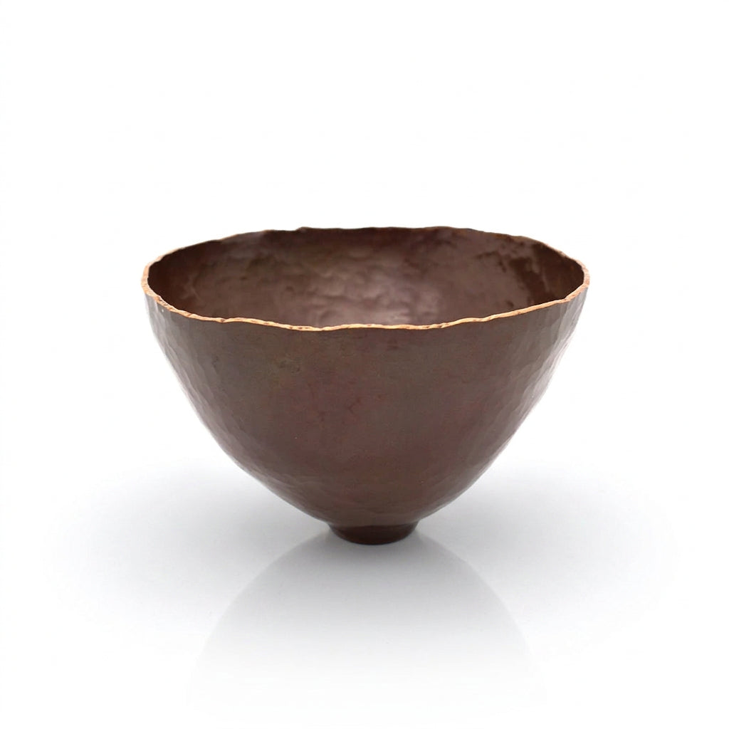 Brown ceramic bowl on a white background.