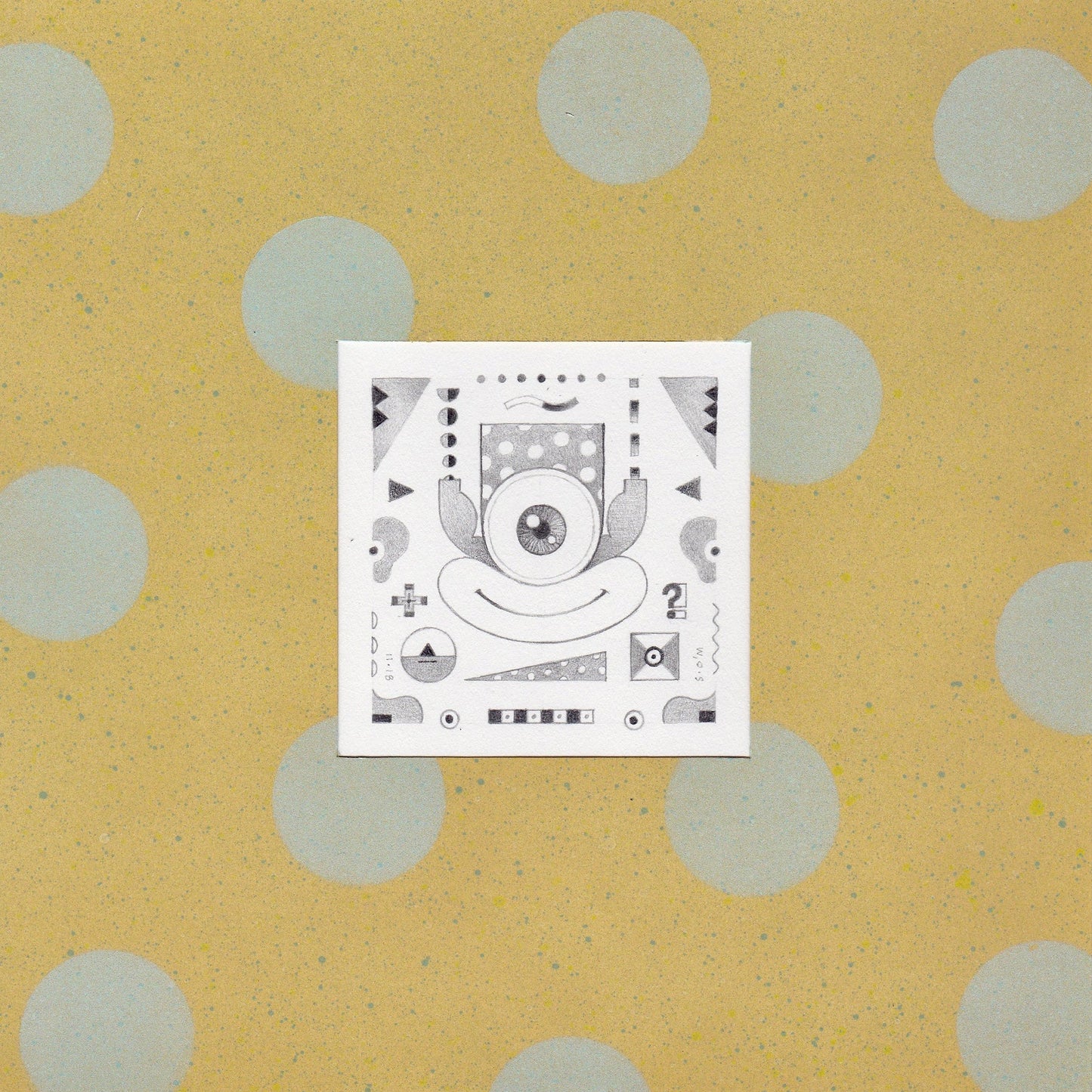Graphite drawing of a figure with one large eye and a large mouth. There are other shapes and symbols behind the figure. The drawing is in the middle of a yellow background with light blue circles. 2018 2.5"x2.5" (9.25"x9.25" framed) graphite on acid-free paper by Sean O'Meallie