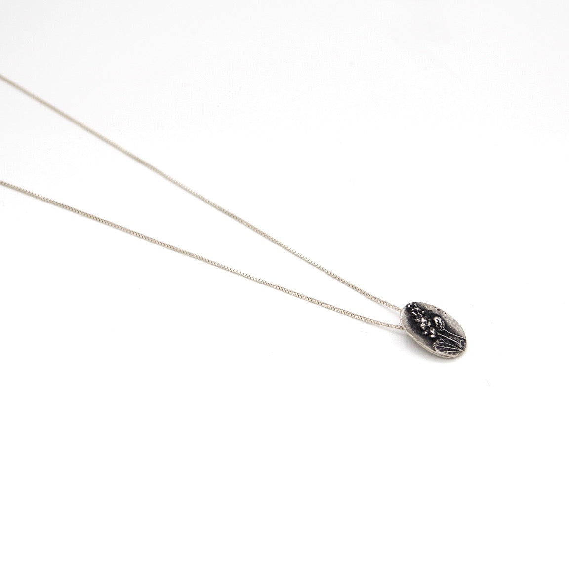 Sterling silver nature inspired, floral detailed small oval pendant necklace by AKA