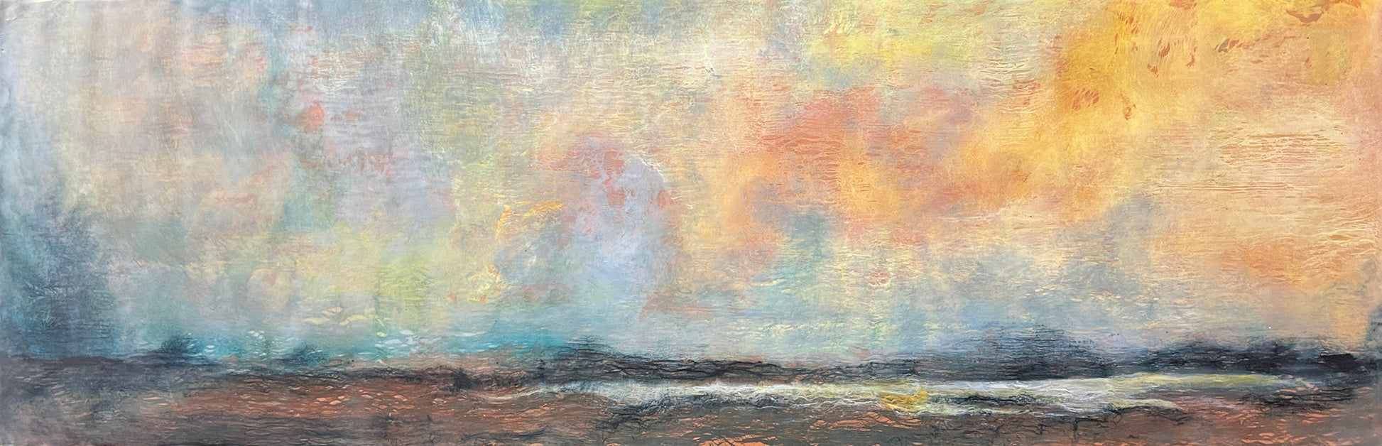 Abstract painting depicting the sky above a field. The sky is a multitude of colors all blending seamlessly together. The bottom portion of the painting is a darker brown and black color. 12"x36" encaustic by Shannon Mello