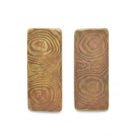 Two rectangular wooden blocks with a textured surface on a white background