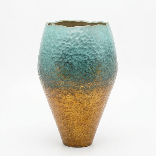Decorative patina copper vase with blue and gold gradient.